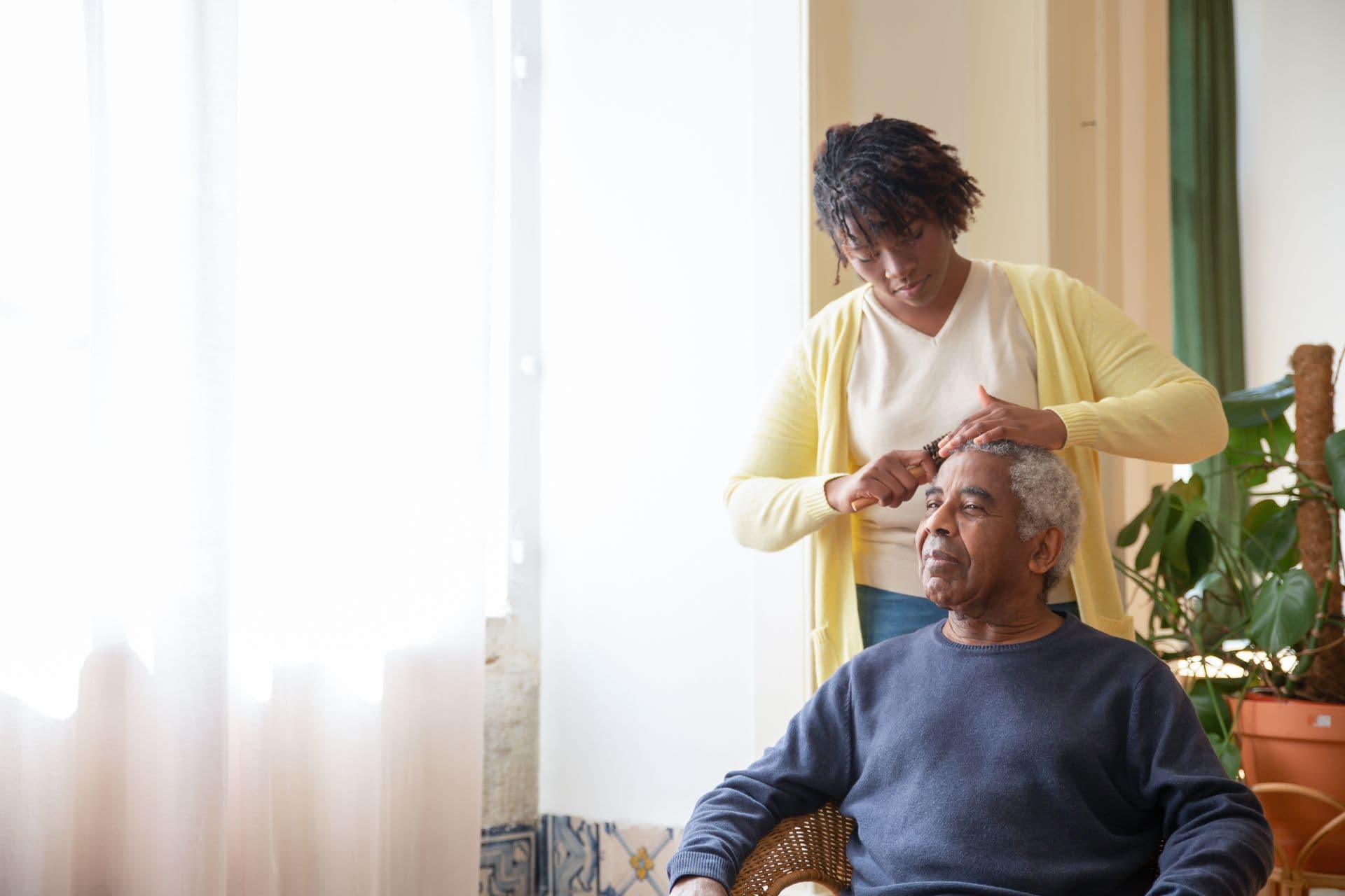 Crossways carers spending time with a client in her home